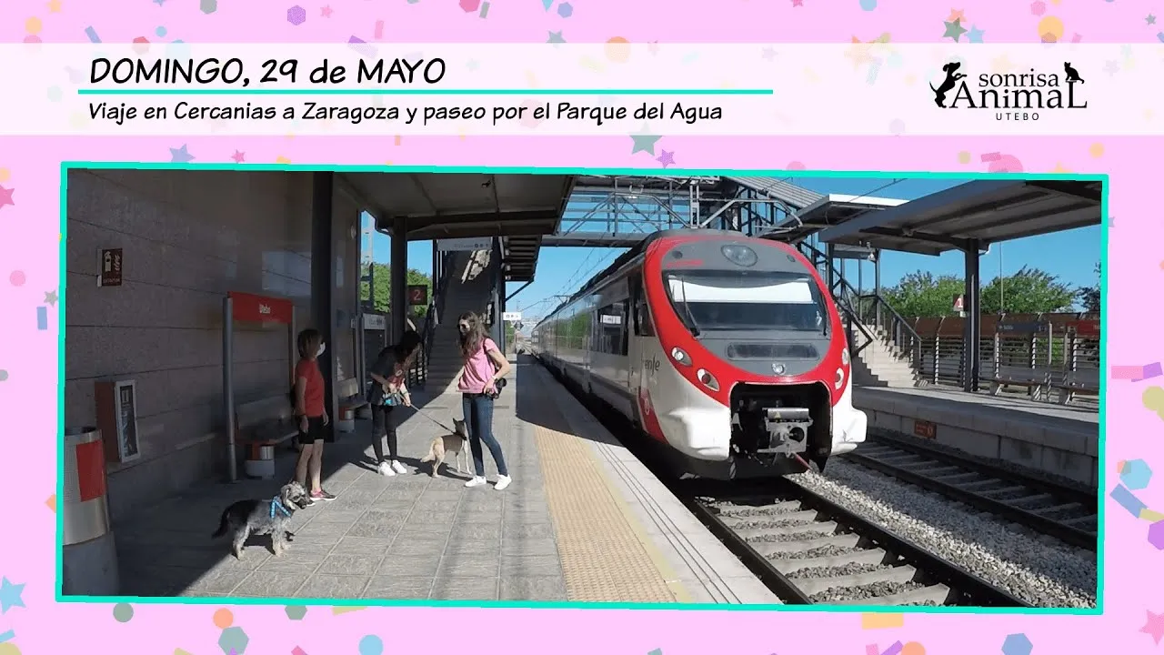 Participantes del viaje en tren y paseo con perros por el Parque del Agua